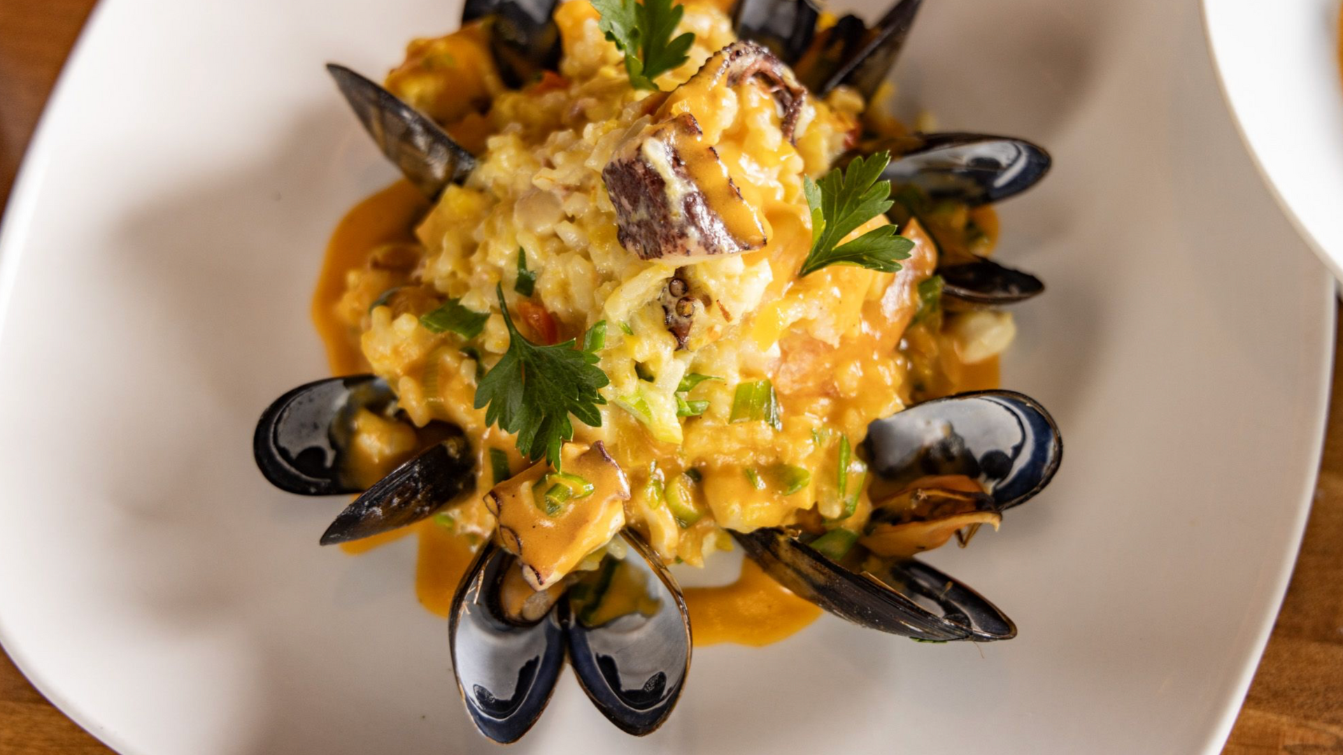 Seafood paella with mussels and saffron rice
